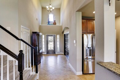 Fresh new look with interior walls painted in a neutral color.  Pretty wrought iron entry front door brings you into this lovely home.  2 Story entry.
