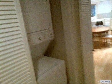 stacked washer/dryer in hall
