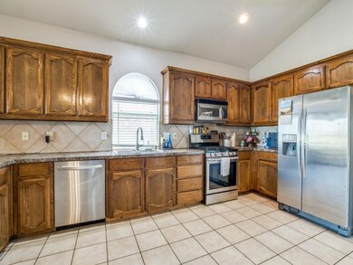 Kitchen featuring light tile patterned flooring, s