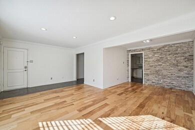 Unfurnished living room with recessed lighting, wo