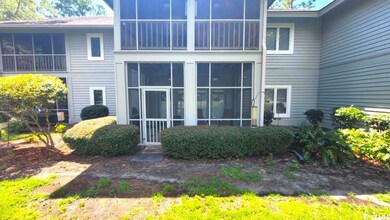 Rear view of property featuring a sunroom