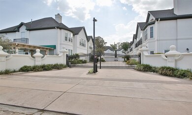 Gated entrance to only 8 stucco homes for added privacy