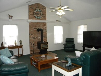 Enjoy the vaulted ceiling and the wood burning sto