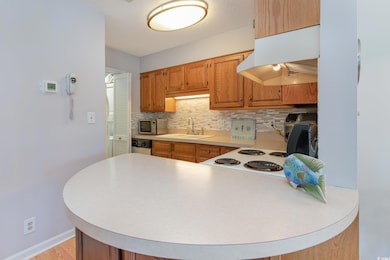Kitchen featuring a sink, light countertops, stain