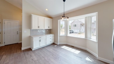 SIMILAR UNIT BAY WINDOW DINING AREA IN KITCHEN