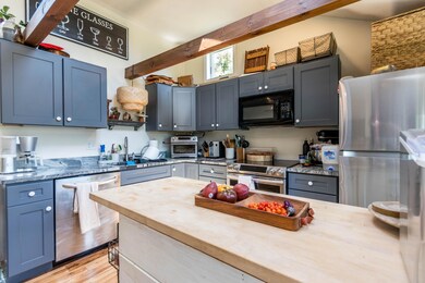 Kitchen with cathedral beamed ceiling
