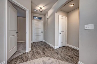Foyer with hardwood / wood-style floors