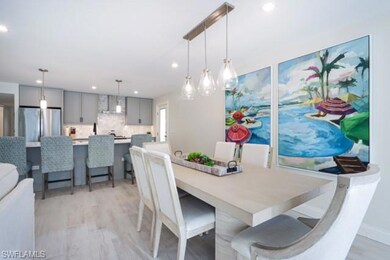 Dining area featuring light wood-type flooring and recessed lighting