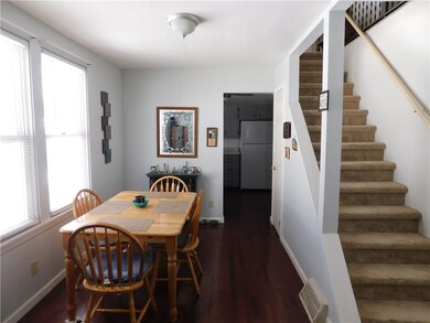 Dining room area with hardwood flooring.