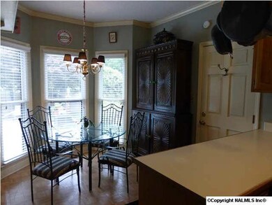 The Breakfast area looks out over the backyard pool.