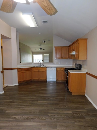 Kitchen featuring dishwasher, range, range hood, 