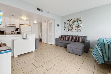 Living area with light tile patterned floors