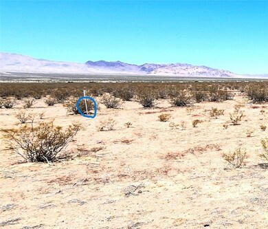 View of mountain backdrop with a desert landscape