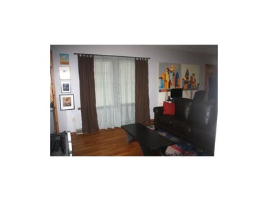 Wood flooring and large windows in the great room
