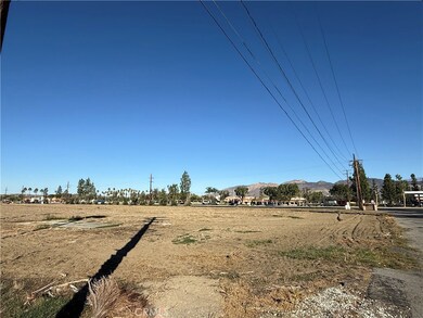 View from back (southeast) corner of property looking north toward shopping center on other side of Florida Avenue.