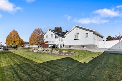 Rear view of property with a gate, stairway, a patio, and a wooden deck