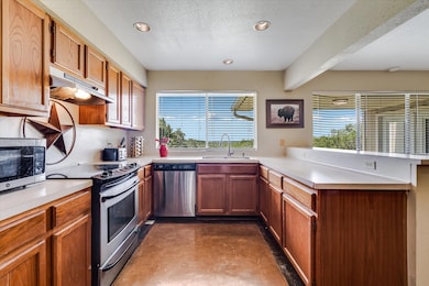 Kitchen featuring stainless steel appliances, a p