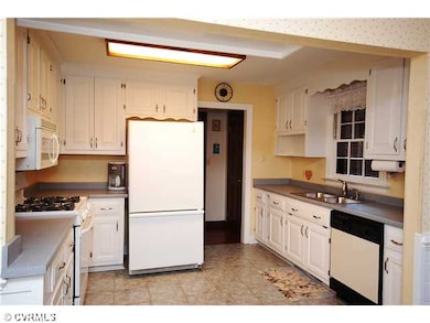 Kitchen - All white cabinetry with updated applian