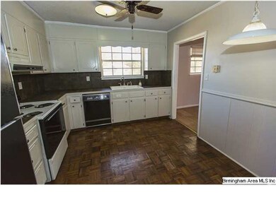 Nice, bright kitchen with parquet floor, tile back