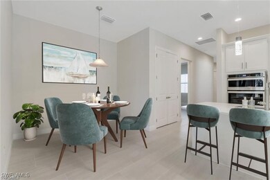 Virtually staged eat in kitchen.