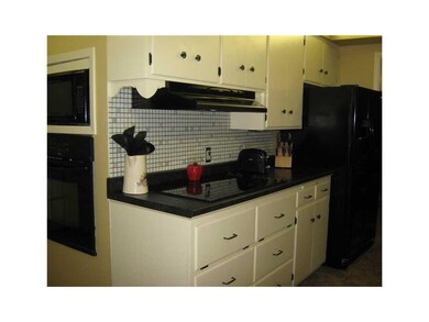 Kitchen. Fridge, stove top, oven, and microwave ar