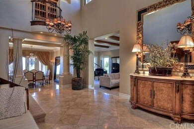 The foyer has volumious ceilings, with dual chande