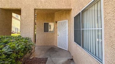 Doorway to property featuring stucco siding
