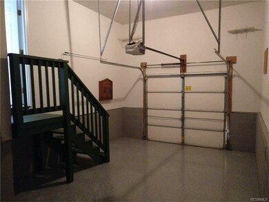 One car garage w/epoxy floor. Large peg board wall