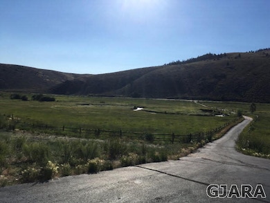 Looking over the 40 acres with river from house de