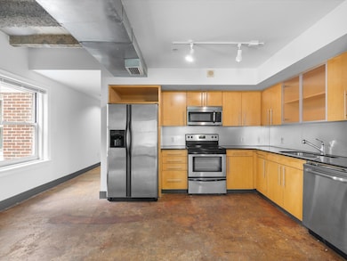 Kitchen featuring stainless steel appliances, open