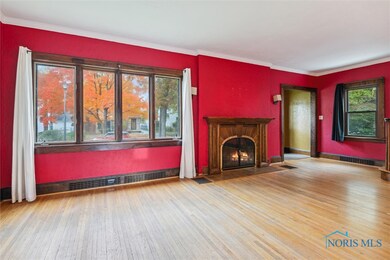 Expansive living room with wood burning fireplace.