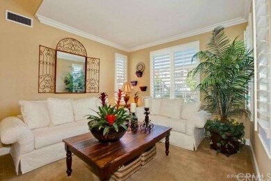 Formal living is beautifully appointed and has lot