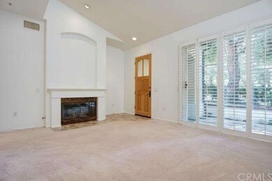 Living room with cozy fireplace and direct access 