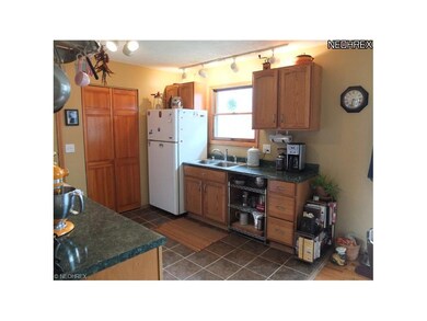 Kitchen with new tile floor.