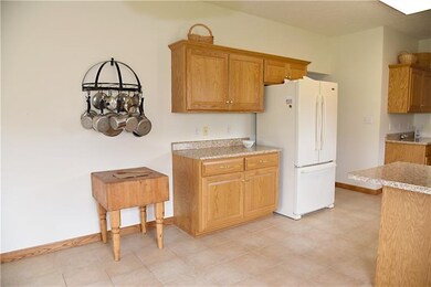 The kitchen has a nice counter space area for ente