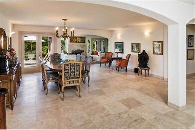 Dining room leads to large backyard and stone deck