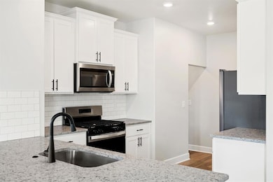 Bright and inviting, this kitchen features clever storage solutions and a clean, modern look.