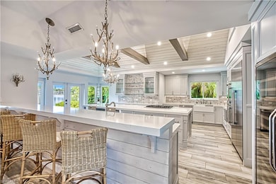 Kitchen featuring a wealth of natural light, hangi