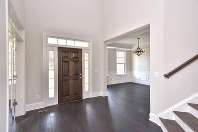 Wood Stained Front Door With Side-lites and a Transom