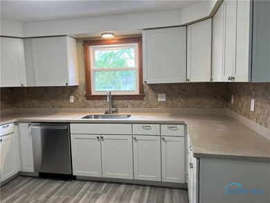 Kitchen is located at the backdoor