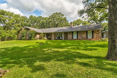 1.25 acres, large shop, over 2500 square feet of remodeled space. Grove school district.