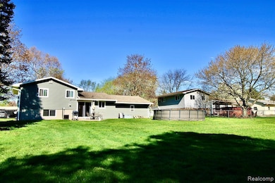 Featuring fenced in backyard!