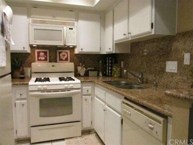Kitchen features granite counter tops, gas stove, 