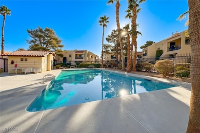 Community pool featuring a residential view and a