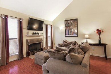 Living room with vaulted ceilings.