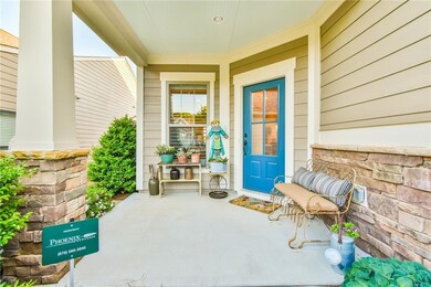Property entrance with covered porch