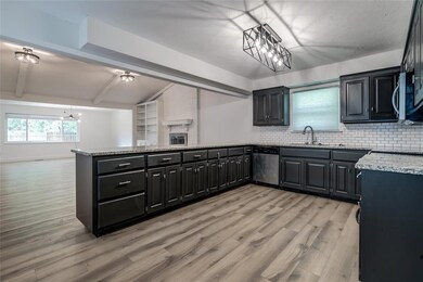 Kitchen with light hardwood / wood-style flooring,