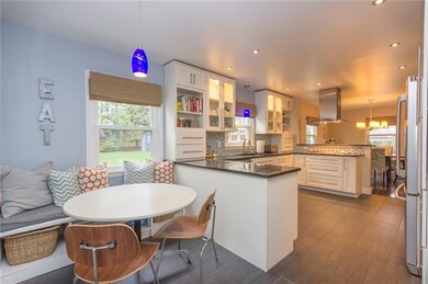 The beautifully updated 18X12 kitchen features gra