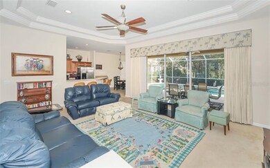 Living room with tray ceiling, ceiling fan/light, 