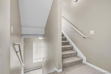 Staircase with carpet flooring and baseboards